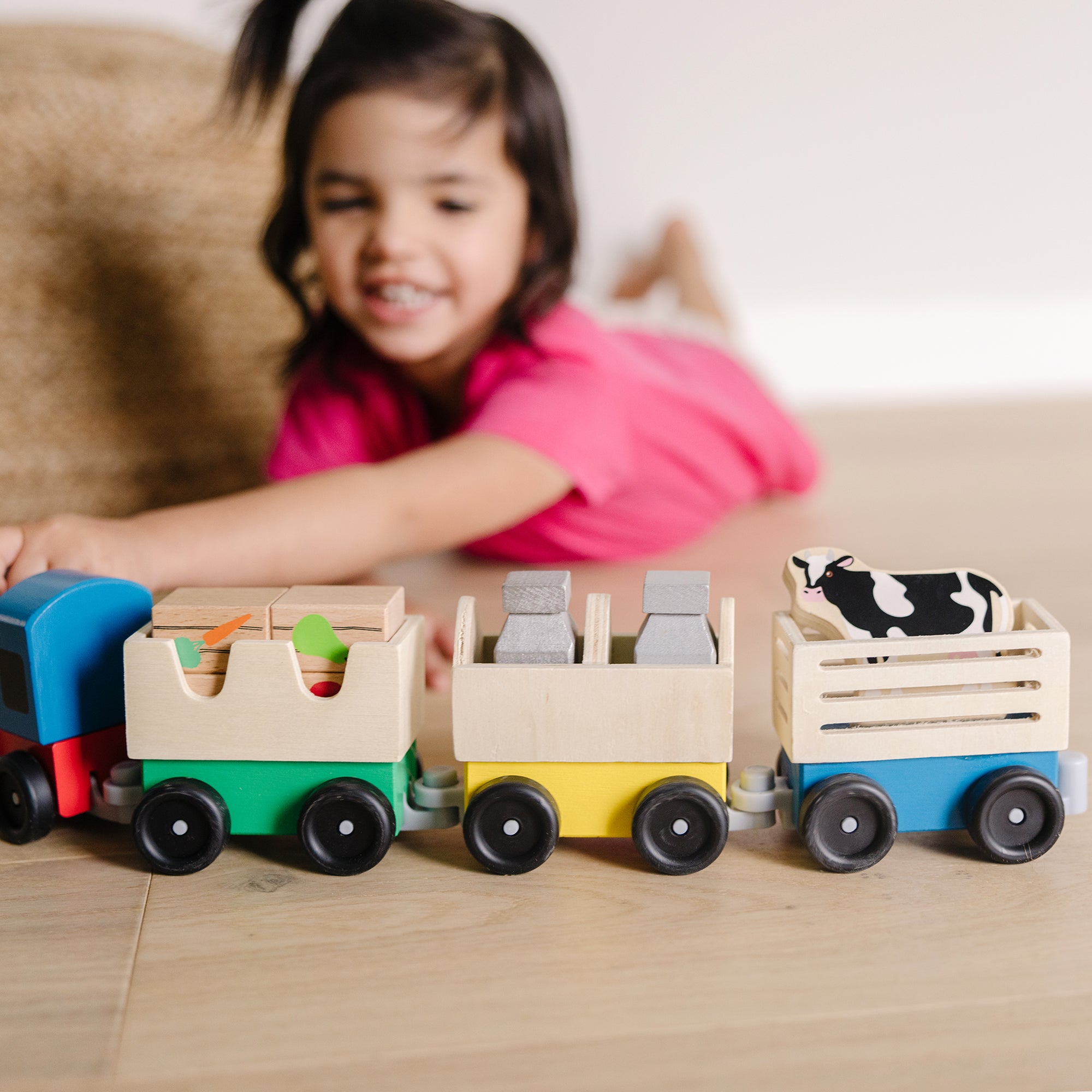Melissa & Doug Wooden Farm Train Set with engine, 3 linking cars and farm cargo